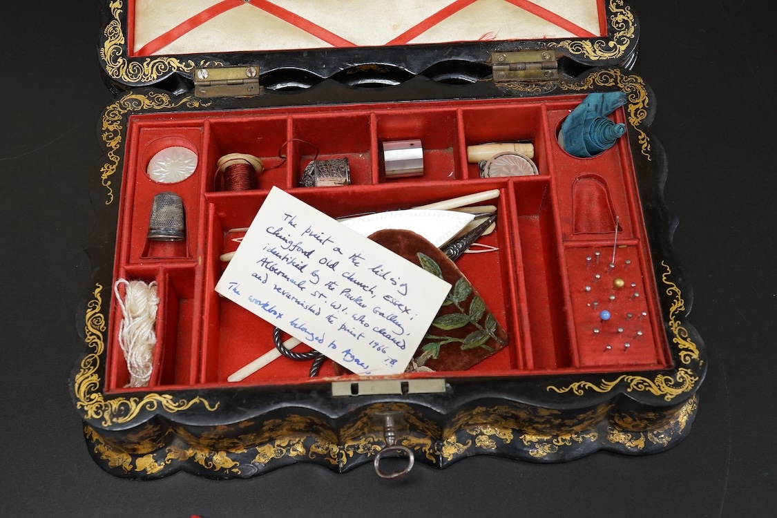 A Victorian Papier mache japanned sewing box, stamped ‘Lane, Birmingham’, the cover with a view of Chingford old church Essex, a boxed Victorian French translation game, by E C Spurin and a papier mache panel (3)